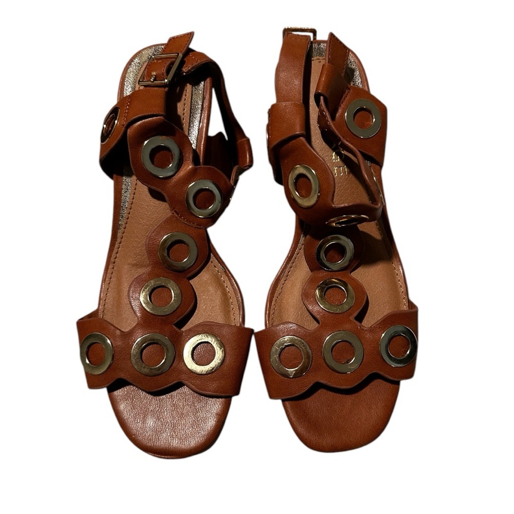 Rampage Illo sling back sandals with grommets and buckle.